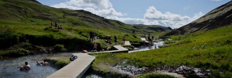 people bathing in a stream in Iceland