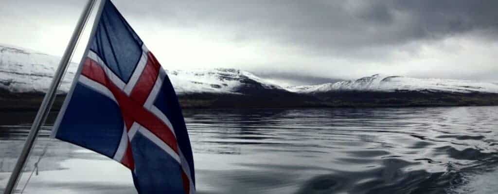 icelandic flag with ocean background
