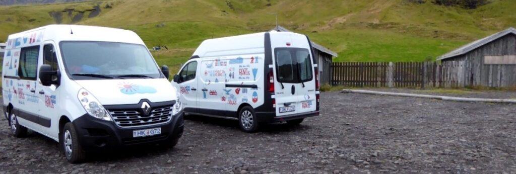 two rent.is camper vans parked in a parkinglot