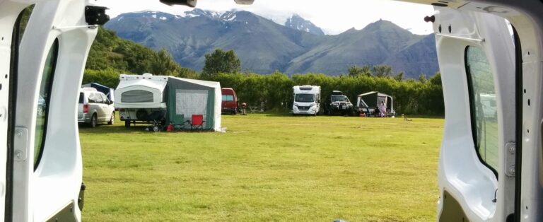 view of campsite from inside a campervan
