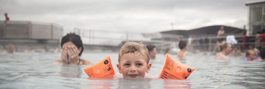 child and mother in the blue lagoon