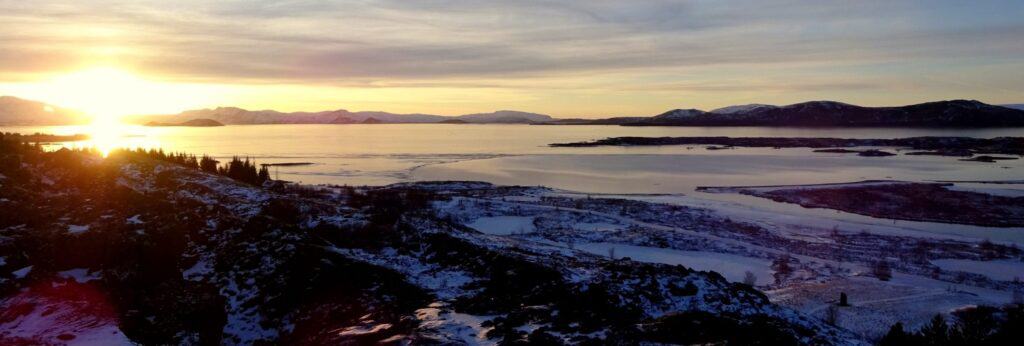 sunset over fields with snow