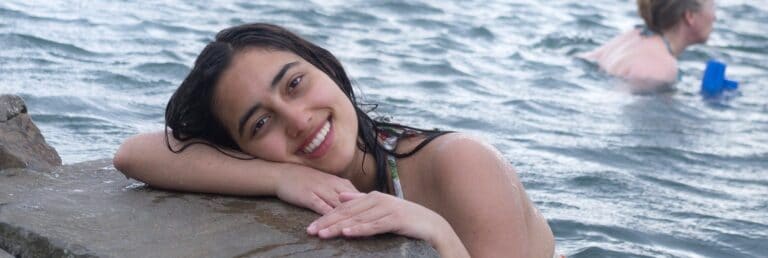 woman smiling in a hot spring