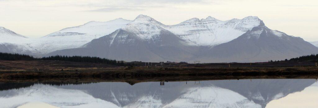 Mountains with snow reflecting in a lake