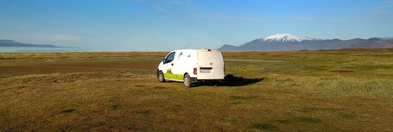 rent.is camper van parked in a field in iceland