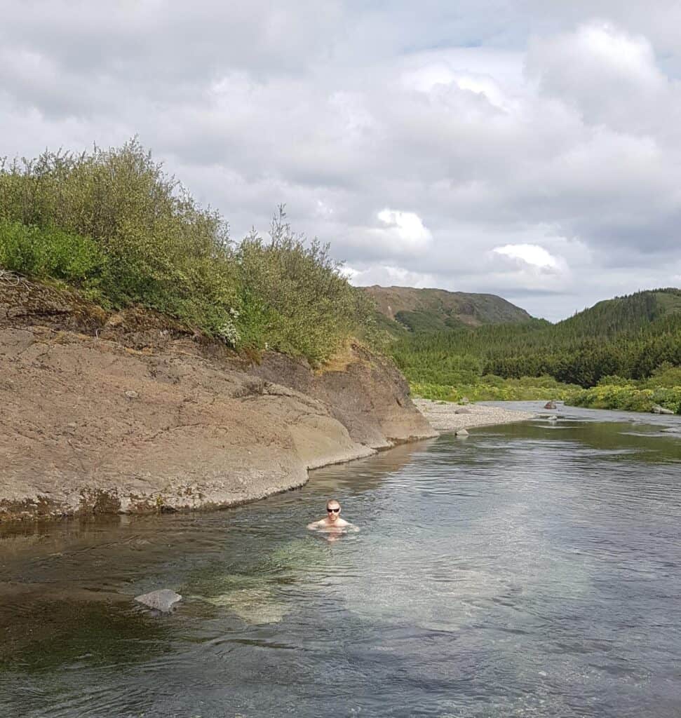 man in lake in iceland