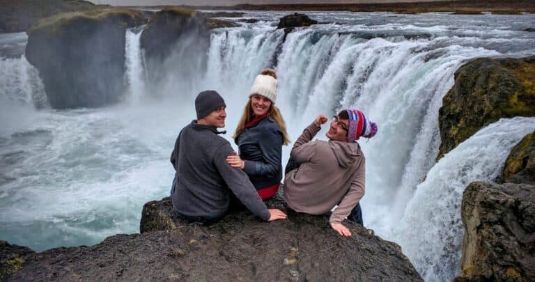 friends on trip around the ring road Iceland, waterfall
