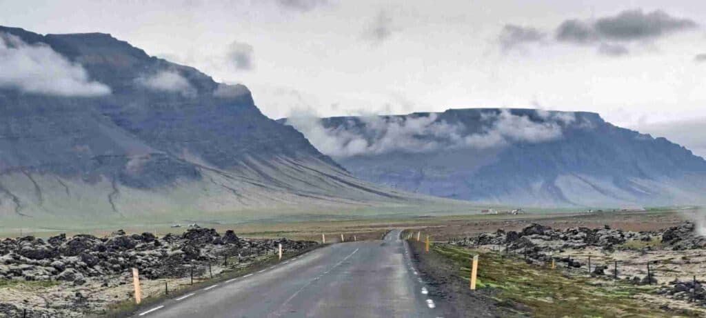 An empty road leading through the nature.