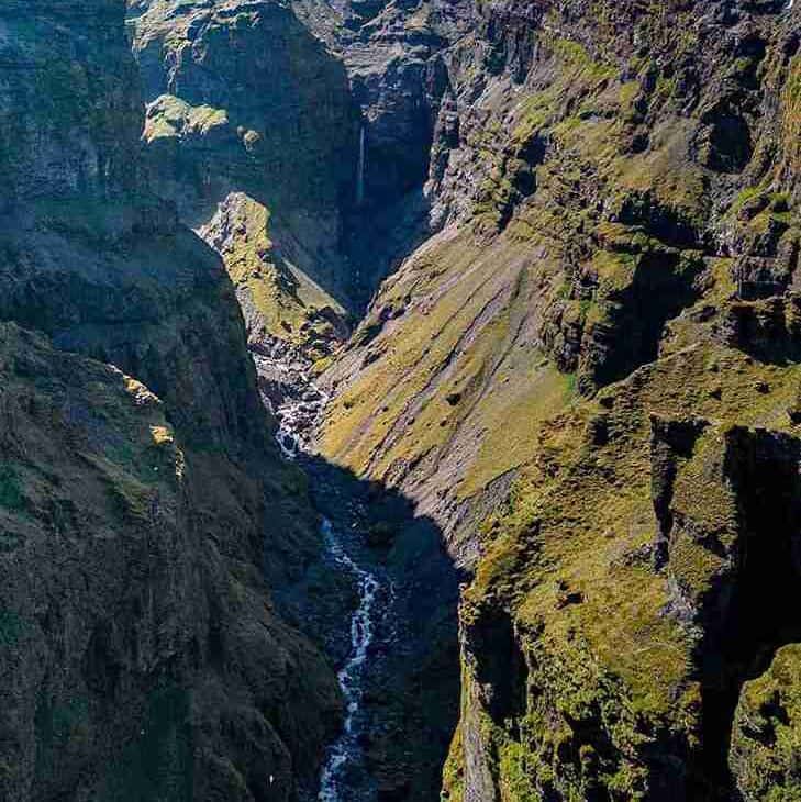 A view of a canyon with a small river