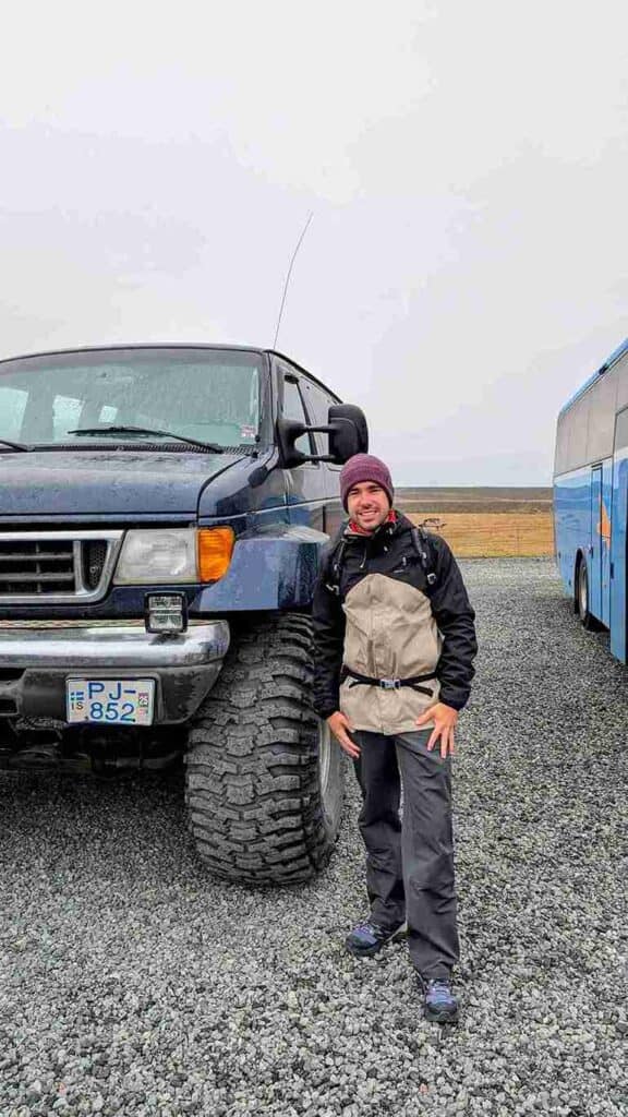 A man standing next to a highlands truck